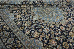 Close-up detail of 2000s Kashan rug from Iran / Persia showing Wool weave
