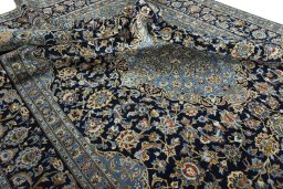 Surface texture of 2000s Kashan rug with natural Wool and intricate pattern