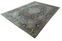Corner detail of 2000s Kashan rug showing border pattern and Wool pile