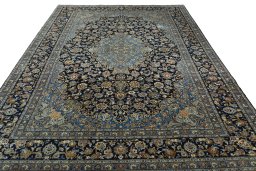 Surface texture of 2000s Kashan rug with natural Wool and intricate pattern