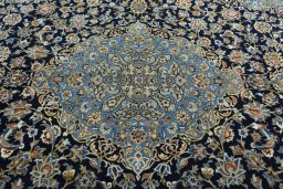 Central medallion detail of 2000s Kashan rug from Iran / Persia