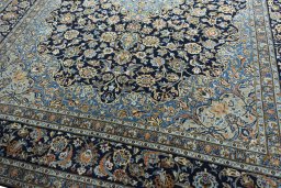 Close-up detail of 2000s Kashan rug from Iran / Persia showing Wool weave