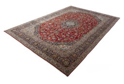 Corner detail of 2000s Kashan rug showing border pattern and Wool pile