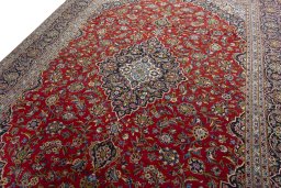 Backside of handmade 2000s Kashan rug showing knot structure and weave density