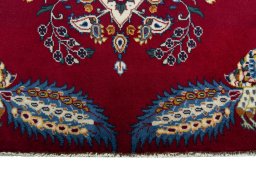 Backside of handmade 2000s Kashan rug showing knot structure and weave density