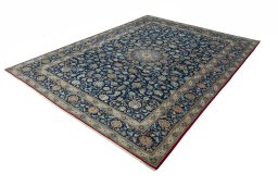 Corner detail of 2000s Kashan rug showing border pattern and Wool pile