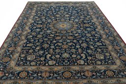 Surface texture of 2000s Kashan rug with natural Wool and intricate pattern
