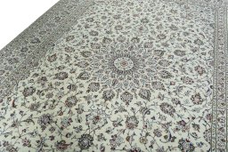Backside of handmade 2000s Kashan rug showing knot structure and weave density