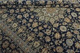 Close-up detail of 2000s Kashan rug from Iran / Persia showing Wool weave