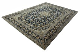 Corner detail of 2000s Kashan rug showing border pattern and Wool pile