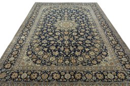 Surface texture of 2000s Kashan rug with natural Wool and intricate pattern