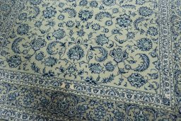 Close-up detail of 2000s Kashan rug from Iran / Persia showing Wool weave