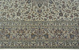 Corner detail of 2000s Kashan rug showing border pattern and Wool pile
