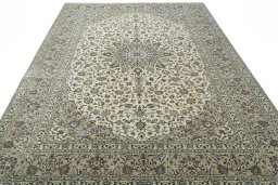 Surface texture of 2000s Kashan rug with natural Wool and intricate pattern