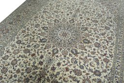 Backside of handmade 2000s Kashan rug showing knot structure and weave density