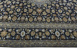 Corner detail of 2000s Kashan rug showing border pattern and Wool pile