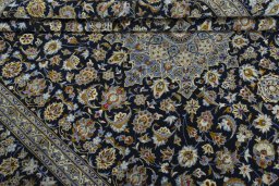 Close-up detail of 2000s Kashan rug from Iran / Persia showing Wool weave