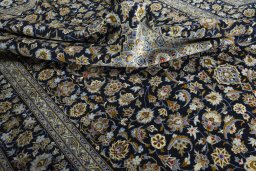 Surface texture of 2000s Kashan rug with natural Wool and intricate pattern