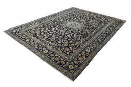 Corner detail of 2000s Kashan rug showing border pattern and Wool pile