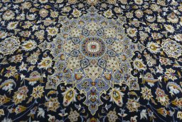 Central medallion detail of 2000s Kashan rug from Iran / Persia