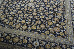 Close-up detail of 2000s Kashan rug from Iran / Persia showing Wool weave