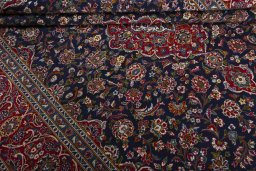Close-up detail of 2000s Kashan rug from Iran / Persia showing Wool weave