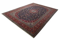 Corner detail of 2000s Kashan rug showing border pattern and Wool pile