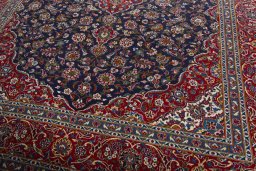 Close-up detail of 2000s Kashan rug from Iran / Persia showing Wool weave