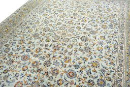 Backside of handmade 2000s Kashan rug showing knot structure and weave density