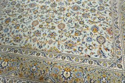 Close-up detail of 2000s Kashan rug from Iran / Persia showing Wool weave
