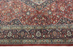 Corner detail of New Kashan rug showing border pattern and Cork pile