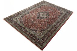 Corner detail of New Kashan rug showing border pattern and Cork pile