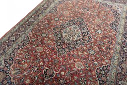 Backside of handmade New Kashan rug showing knot structure and weave density