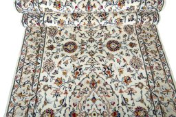 Corner detail of New Kashan rug showing border pattern and Wool pile