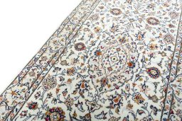 Backside of handmade New Kashan rug showing knot structure and weave density