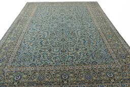 Surface texture of 2000s Kashan rug with natural Wool and intricate pattern