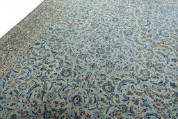 Backside of handmade 2000s Kashan rug showing knot structure and weave density