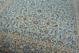 Close-up detail of 2000s Kashan rug from Iran / Persia showing Wool weave
