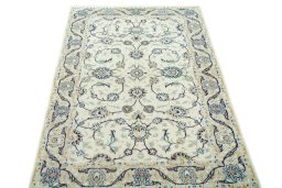 Surface texture of 2000s Kashan rug with natural Wool and intricate pattern