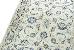 Backside of handmade 2000s Kashan rug showing knot structure and weave density