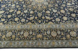 Corner detail of 2000s Kashan rug showing border pattern and Wool pile
