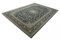 Corner detail of 2000s Kashan rug showing border pattern and Wool pile