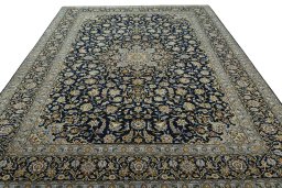 Surface texture of 2000s Kashan rug with natural Wool and intricate pattern