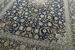 Close-up detail of 2000s Kashan rug from Iran / Persia showing Wool weave