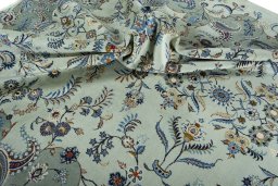 Surface texture of 2000s Kashan rug with natural Wool and intricate pattern