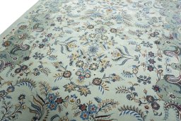 Backside of handmade 2000s Kashan rug showing knot structure and weave density