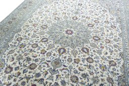 Backside of handmade 2000s Kashan rug showing knot structure and weave density