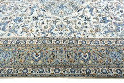 Corner detail of 2000s Kashan rug showing border pattern and Wool pile