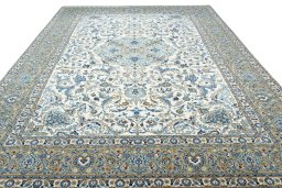Surface texture of 2000s Kashan rug with natural Wool and intricate pattern