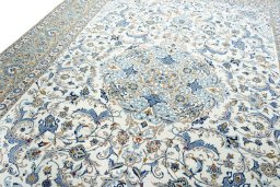 Backside of handmade 2000s Kashan rug showing knot structure and weave density